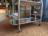 a metal cart that is sitting on the floor
