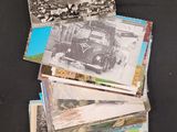 a pile of old photos sitting on a table