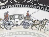 a plate with a picture of a horse drawn carriage on it