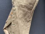 a close up of a pair of pants with buttons on them