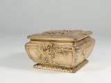 an antique gold box with a lid and a design of a man and woman