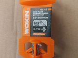 an orange and black screwdriver sitting on top of a cardboard box