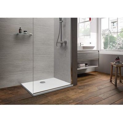 a close up of a walk in shower with a wooden floor