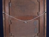 an old wooden easel with a rope on top of it