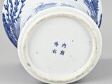 an image of a blue and white vase with a fish design on it