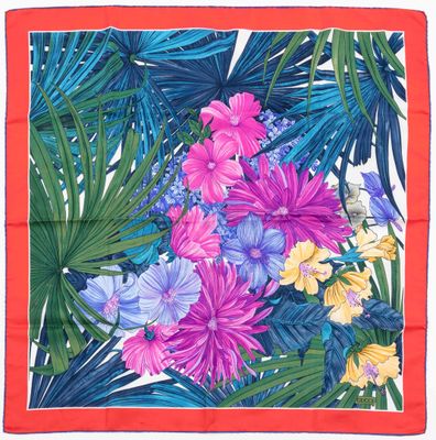 a close up of a colorful floral print scarf on a white background