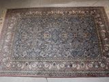 a rug on the floor in the middle of the room
