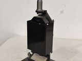 an old stove on a table with a white background