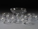 a lot of empty wine glasses and a bowl on the table