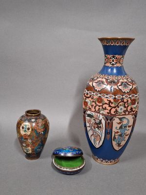 three vases sitting next to each other on a table