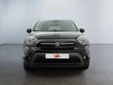 the front view of a black fiat suv parked in a white room
