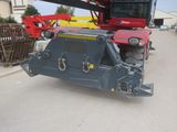 a large crane that is sitting on the side of the road