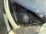 a dirty seat in the back of a car