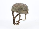 a helmet that is sitting on the ground in the snow
