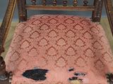 an old wooden chair with a pink upholstered upholstered seat