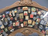 a mirror with a lot of pins on it