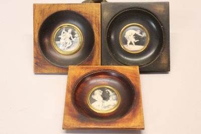 three framed pictures of a man and a woman in a wood frame