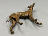 antique bronze greyhound dog figurine on white background
