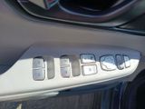 a close up of a car door handle with buttons