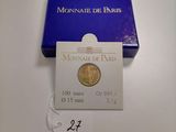 a close up of a box of coins on a table