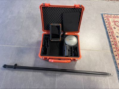 an orange case that has a cell phone in it