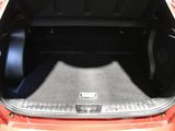 a trunk of an orange car with the trunk open