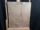 a wooden easel with a piece of wood on top of it