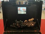 a black case with a television inside of it