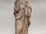 an old statue of a woman holding a child in her arms