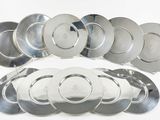 a lot of silver plates on a white surface