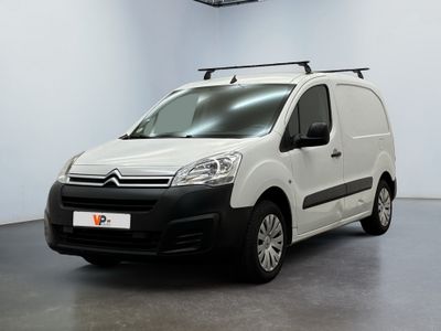 the white van is parked in a white room with a black roof rack