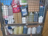 a shopping cart full of bottles of milk and other items