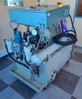 a machine that is sitting in a room with a checkered floor