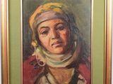 painting of a woman in a headscarf in a green frame