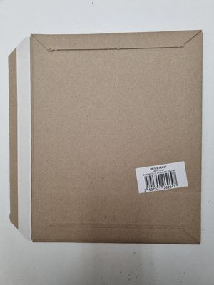 an open box with a sticker on it sitting on top of a table