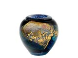 a blue vase with a gold leaf design on it