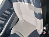 a picture of a seat in a car with a remote control