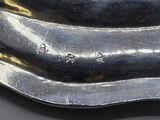 a close up of a spoon and fork on a table