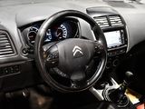 the interior of a car with a steering wheel, dashboard, and dash board