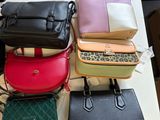 a lot of purses that are on a table