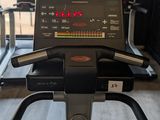a view of a tread machine in a gym room