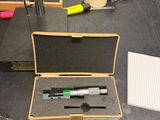 a box that has some tools in it on a table