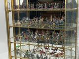 a display case with a lot of miniature figurines in it