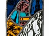 a stained glass panel with a picture of jesus on it