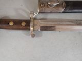 two knives that are laying next to each other on a table