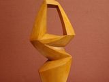 a wooden sculpture that is sitting on a table