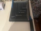 a cutting board and a pair of scissors on a table
