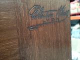 a close up of a wooden table with a sign on it