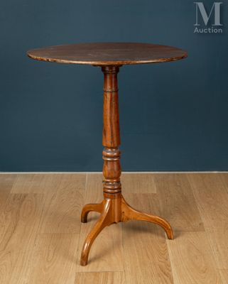a wooden table sitting on top of a hard wood floor