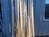 a lot of different types of wood in front of a building